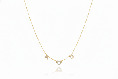 Gold necklace with letter 'A' pendant on a white background