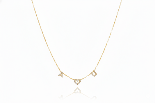 Gold necklace with letter 'A' pendant on a white background