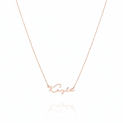 Rose gold necklace with 'Kylie' pendant on a white background