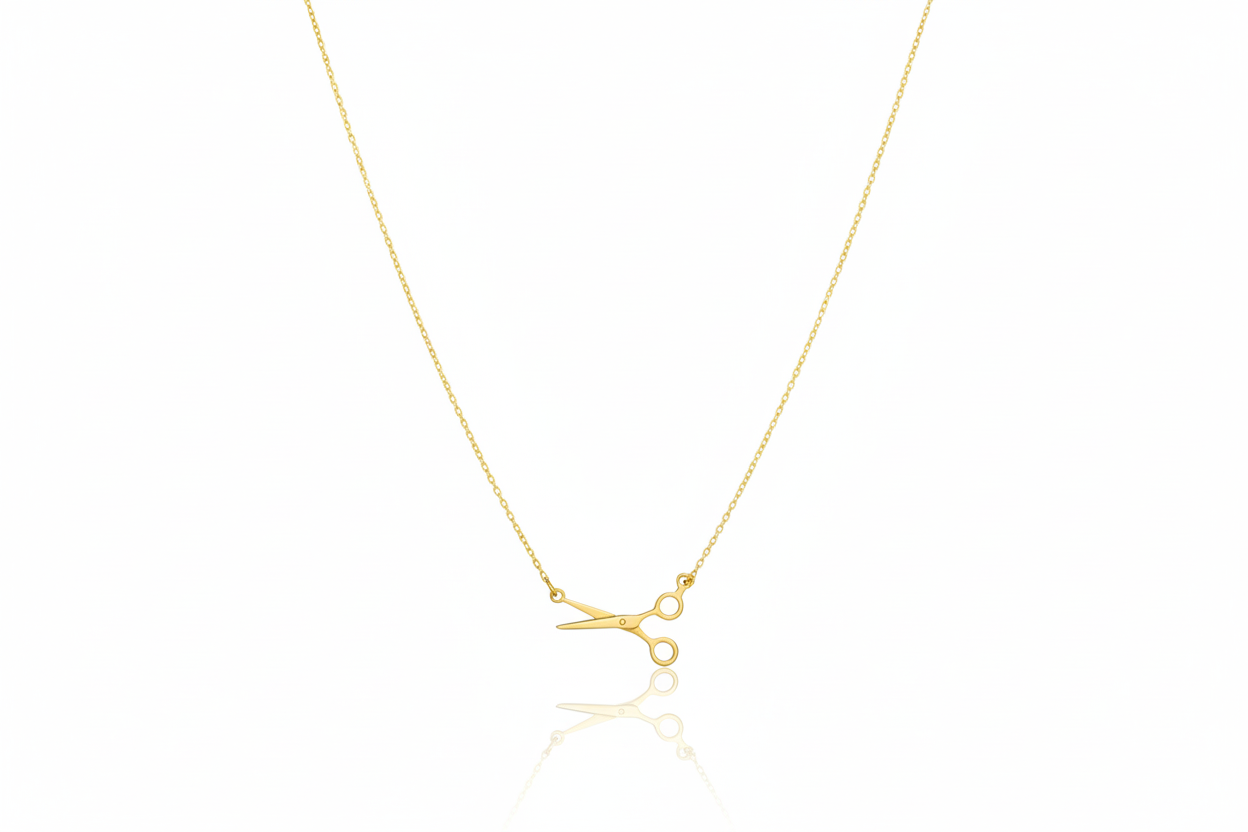 Gold necklace with a small pendant on a white background
