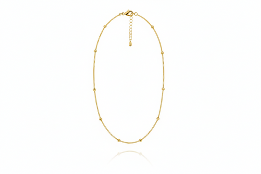 Gold necklace on a white background