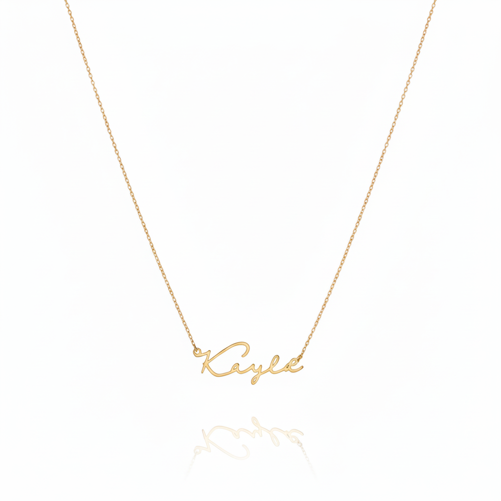 Gold necklace with 'Kayla' pendant on a white background