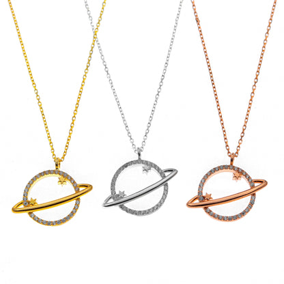 Three planet-shaped necklaces in gold, silver, and rose gold on a white background
