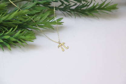 a dainty pendant necklace with the Pi symbol, in a gold-tone finish.
