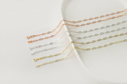 A close-up image of 6 link loop chain necklaces with a delicate and dainty design.