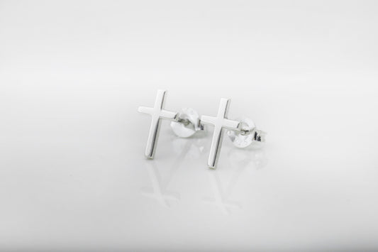 Silver cross-shaped earrings on a white background