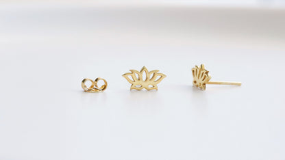 a 14K gold dainty lotus flower stud earring in a white background.