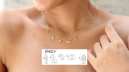 A close-up image of a 14K gold personalized hieroglyphics necklace with a dainty waterproof link chain, shown around a person's neck.