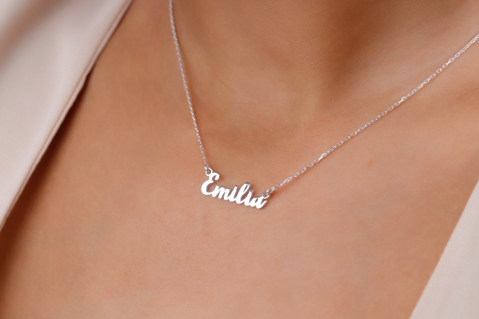 Silver 'Emilie' necklace on a person's neck