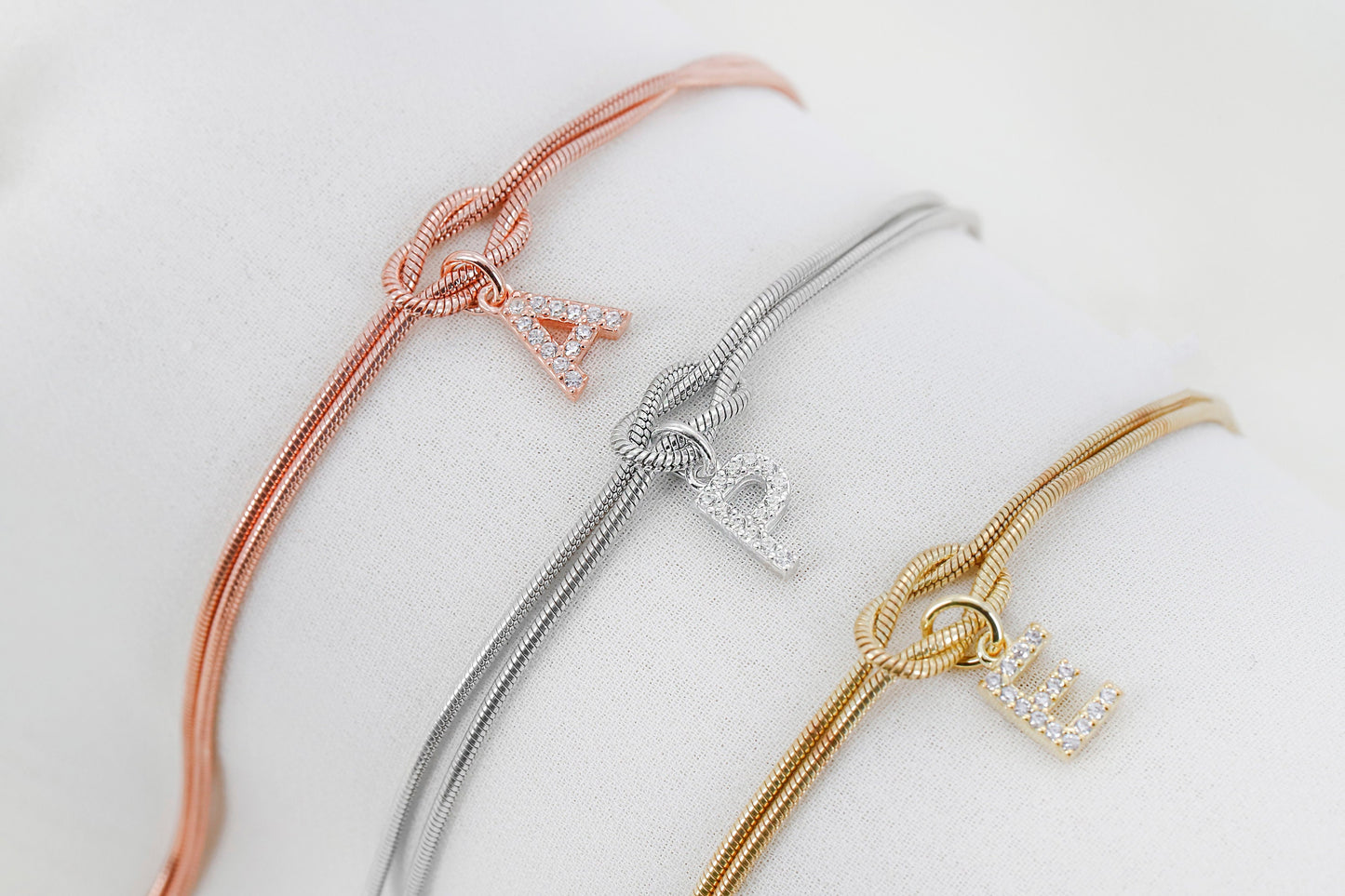 Custom 14K Gold Infinite Love Knot Bracelet with CZ Diamond Letter by NecklaceDreamWorld | Dainty Friendship Bracelets - silvergoldandrose