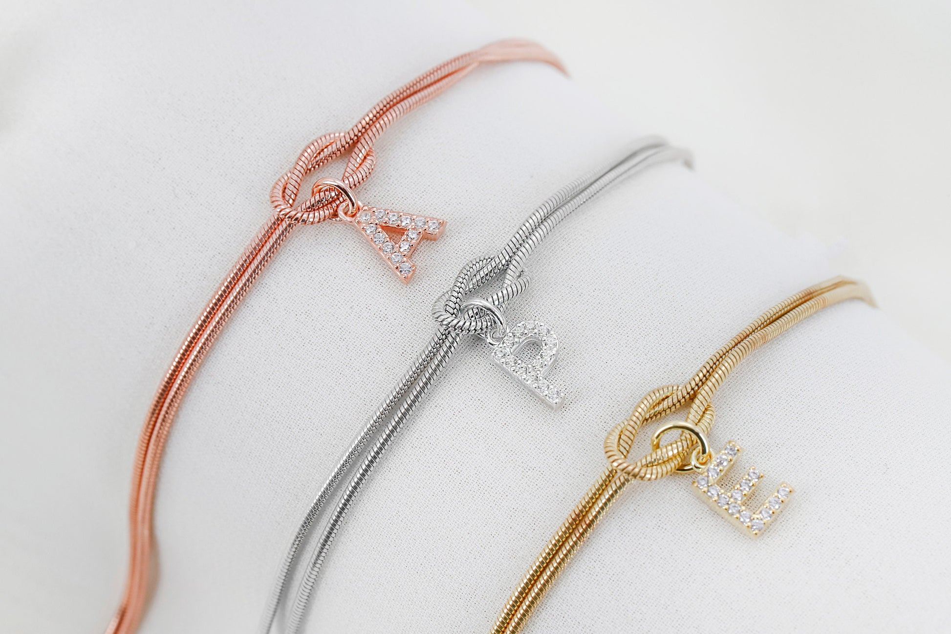 Custom 14K Gold Infinite Love Knot Bracelet with CZ Diamond Letter by NecklaceDreamWorld | Dainty Friendship Bracelets - silvergoldandrose