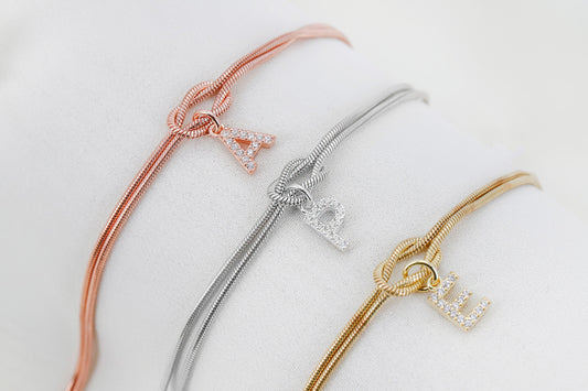 Custom 14K Gold Infinite Love Knot Bracelet with CZ Diamond Letter by NecklaceDreamWorld | Dainty Friendship Bracelets - silvergoldandrose
