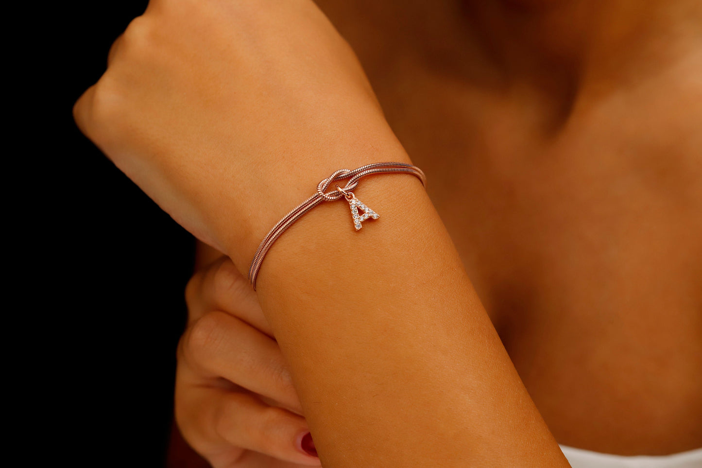 Custom 14K Gold Infinite Love Knot Bracelet with CZ Diamond Letter by NecklaceDreamWorld | Dainty Friendship Bracelets - silvergoldandrose