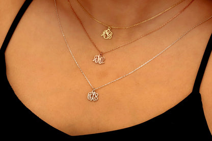 three monogram necklaces with the initials