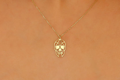 A close-up image of a person wearing a sterling silver necklace with a sugar skull pendant.
