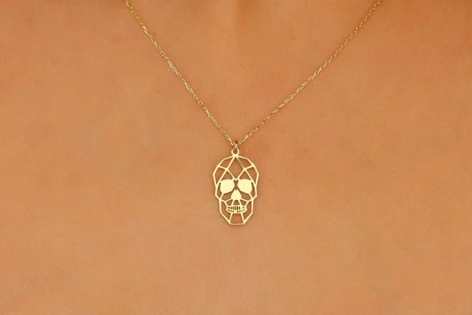 A close-up image of a person wearing a sterling silver necklace with a sugar skull pendant.