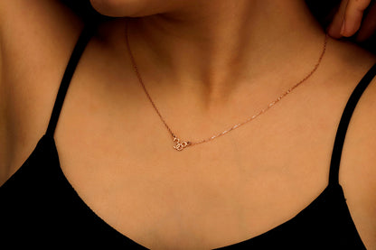 a lucky numbers necklace says 38 in rose gold.