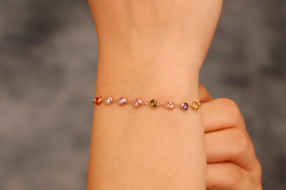 Multicolored beaded bracelet on a wrist with a blurred background