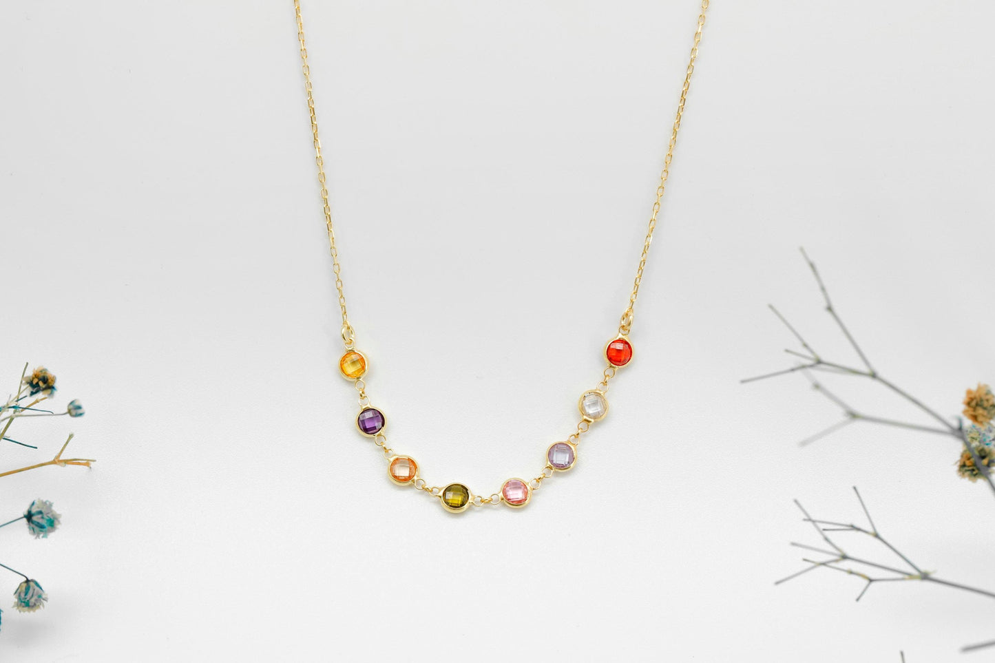 Necklace with colorful beads on a light gray background