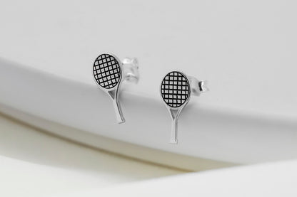A close-up image of a 925 sterling silver tennis racket stud earring.