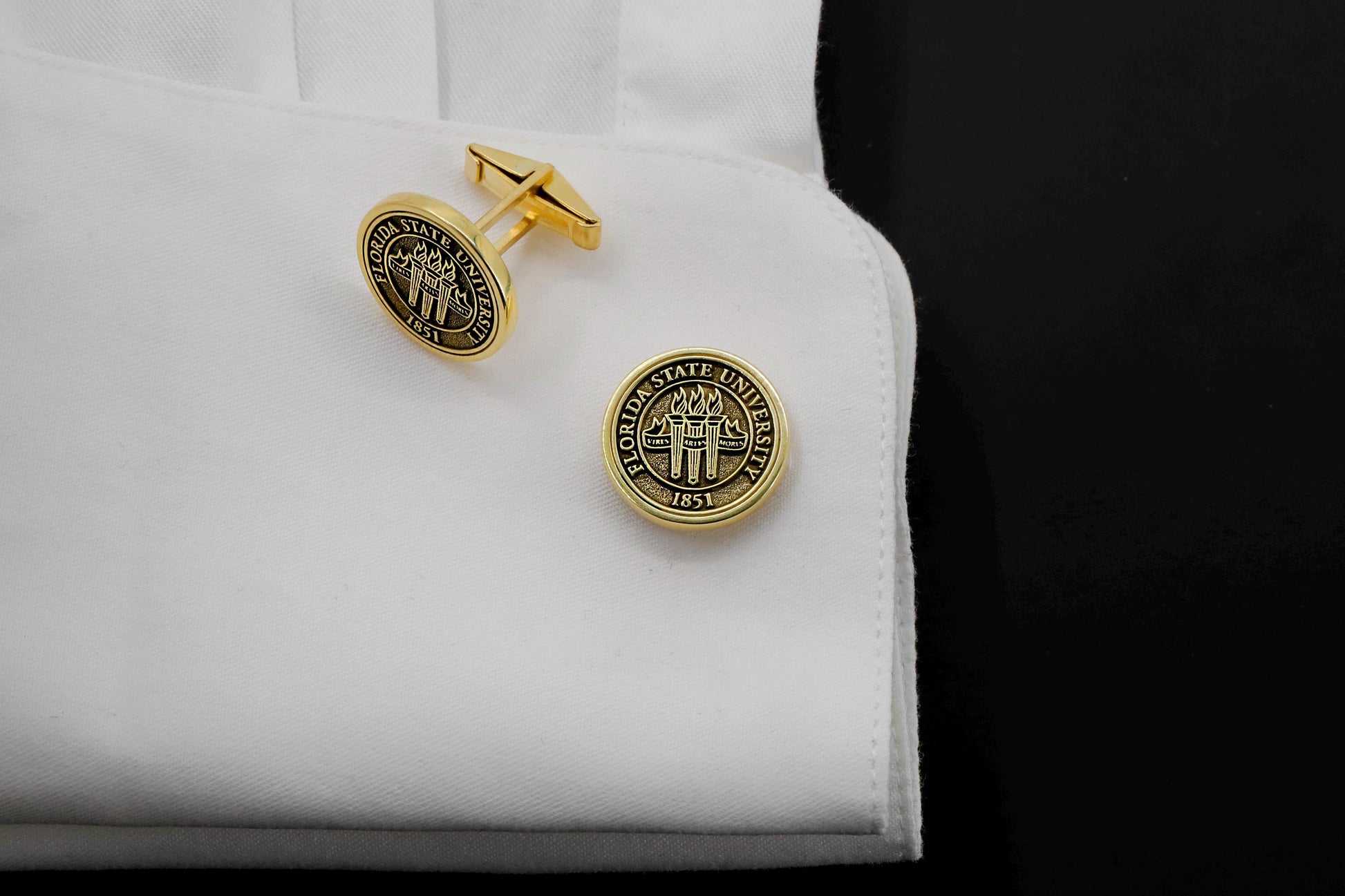 A set of personalized sterling silver cufflinks with FLORIDA STATE UNIVERSITY seal, available in different colors such as gold, silver, and rose gold.