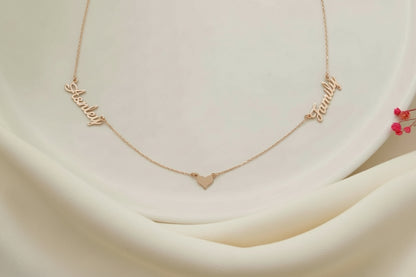 Gold necklace with heart pendant on a soft beige background