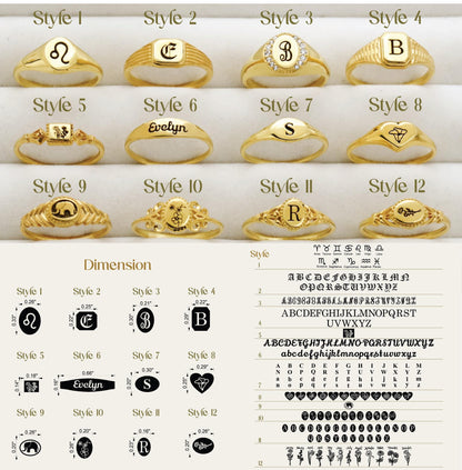 Collection of gold rings with various designs and letterings on a white background.
