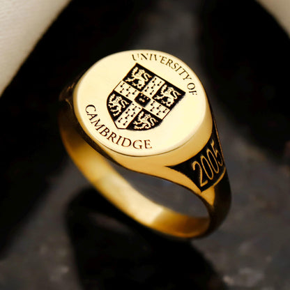 Gold ring with 'University of Cambridge' emblem and year '2005'