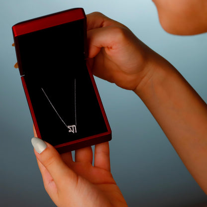 Person holding a red phone with a black screen against a gradient background