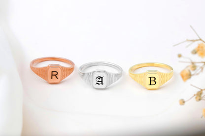 Three rings with letters 'R', 'A', and 'B' on a white background